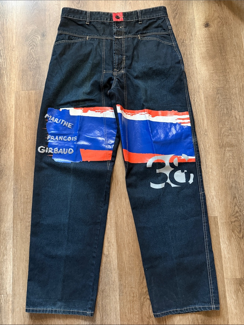 Marithé + François Girbaud jeans with a large graphic print across the legs